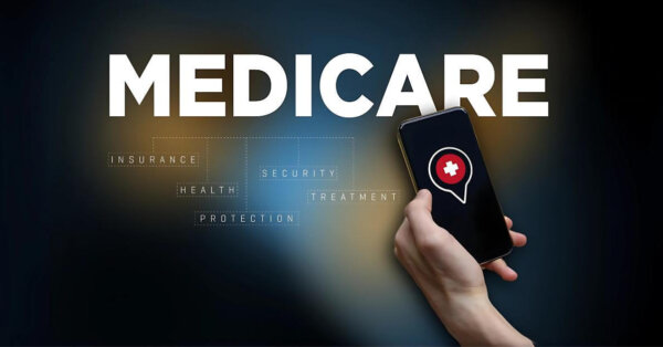 Hand holding a smartphone with a medical cross icon, adjacent to the word "MEDICARE," highlighting related keywords and updates on medicare advantage news.